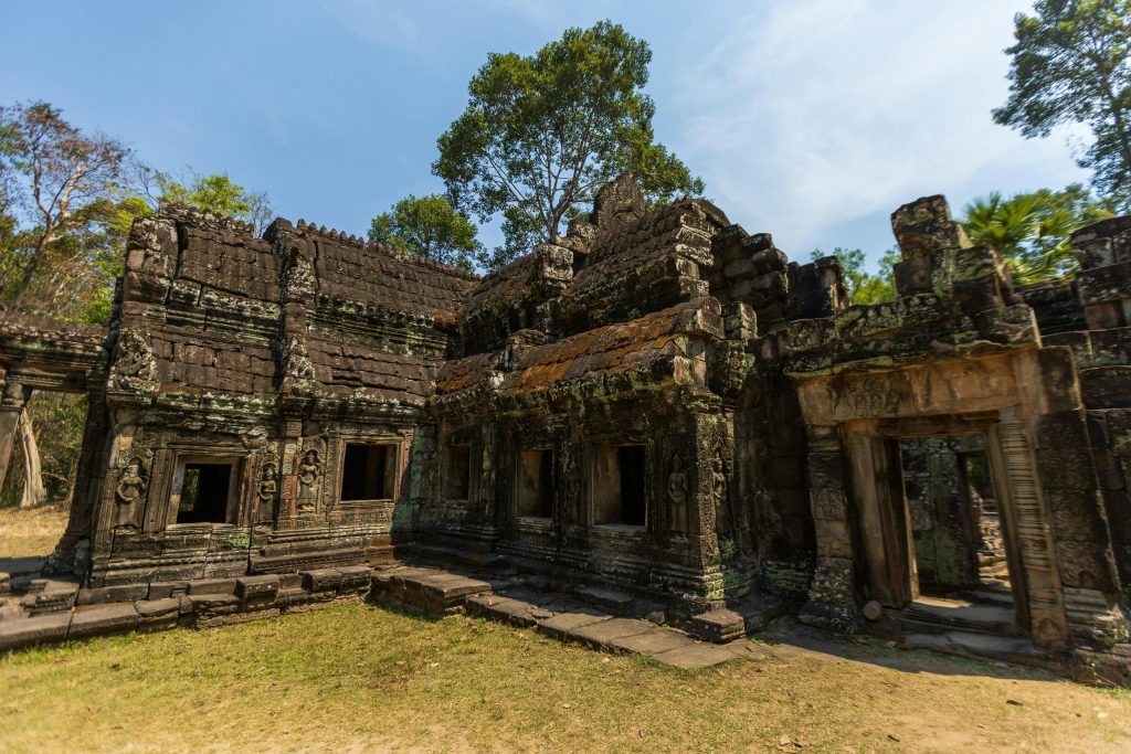 Explore the ancient ruins of the Angkor Wat complex in Cambodia, showcasing historical architecture.