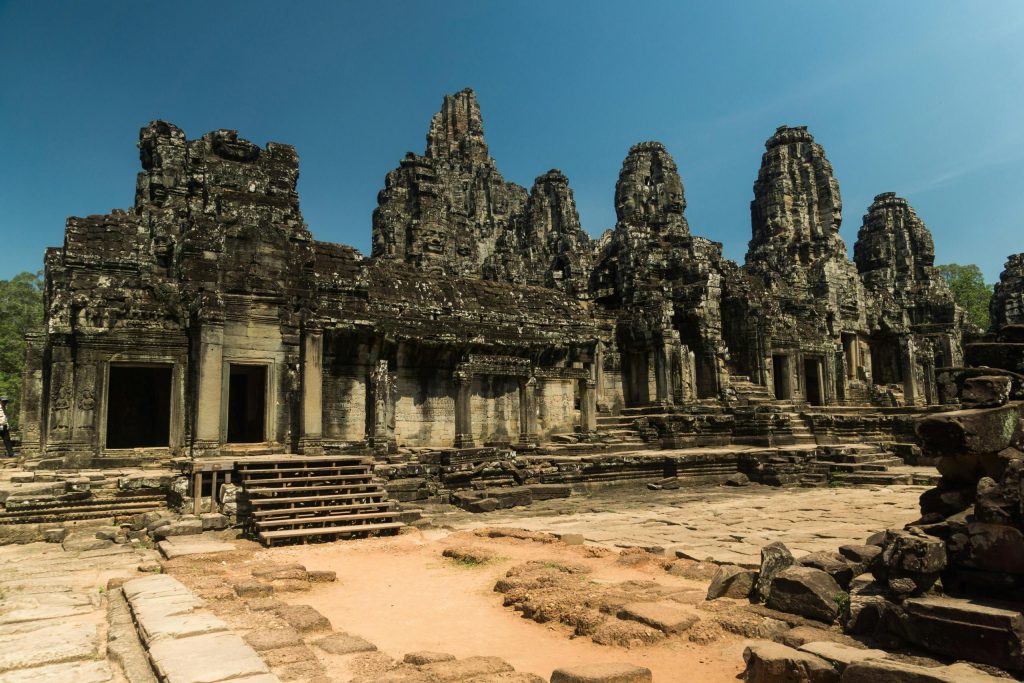 Explore the ancient architecture of Bayon Temple in Cambodia's Angkor Thom, a UNESCO World Heritage Site.